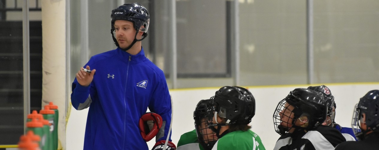 Coach With Young Hockey Players